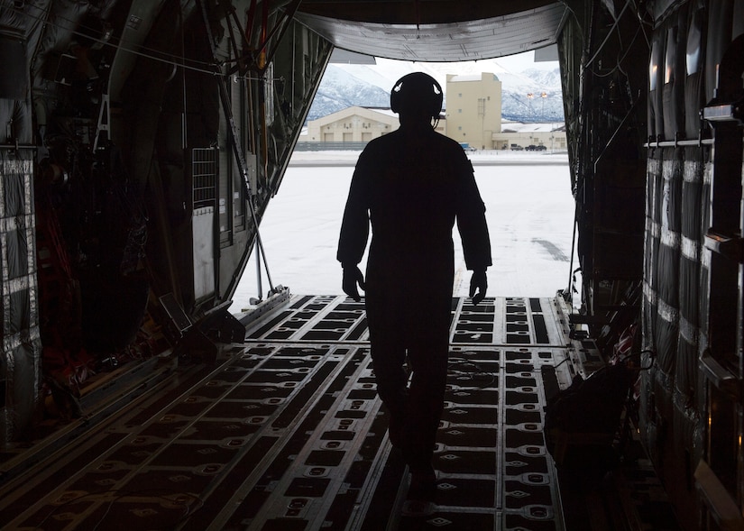 U.S. Air Force Tech. Sgt. Eric Dickerson, a loadmaster assigned to the 211th Rescue Squadron, Alaska Air National Guard, conducts a preflight check on a HC-130J Combat King II at Joint Base Elmendorf-Richardson, Alaska, Jan. 21, 2021, during Operation Noble Defender. Operation Noble Defender is a North American Aerospace Defense Command air-defense operation which allows dynamic training for operational readiness in an arctic environment.