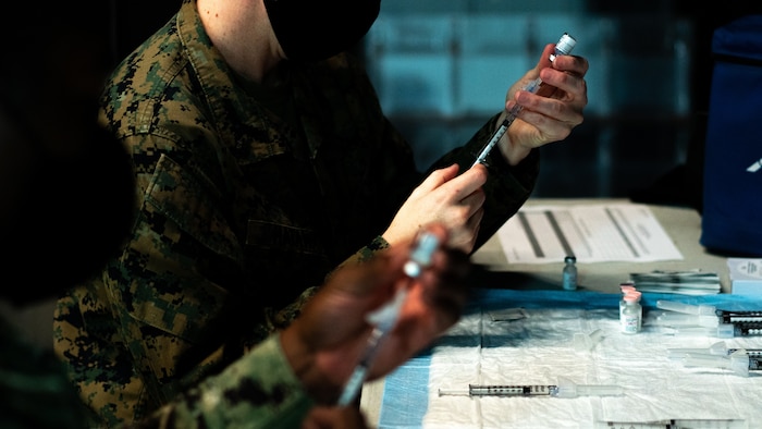 U.S. Marines prepare the Pfizer-BioNTech COVID-19 Vaccine on Camp Lejeune, N.C., Jan. 15.