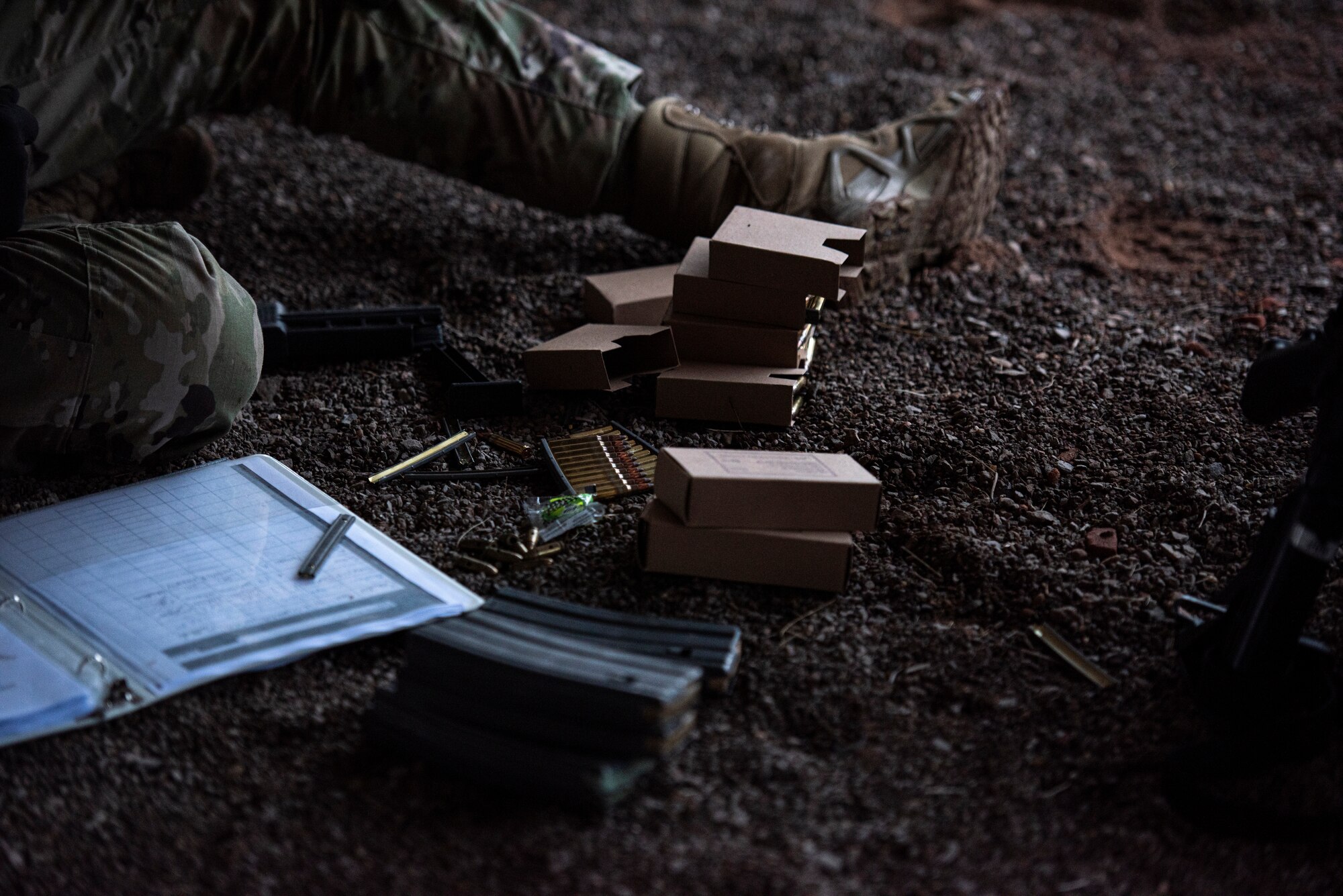 U.S. Air Force Airman 1st Class Domenico Fabrizio, 569th U.S. Forces Police Squadron installation entry controller, sits with boxes of ammunition at Breitenwald Landstuhl Range, Germany, Jan. 20, 2021.