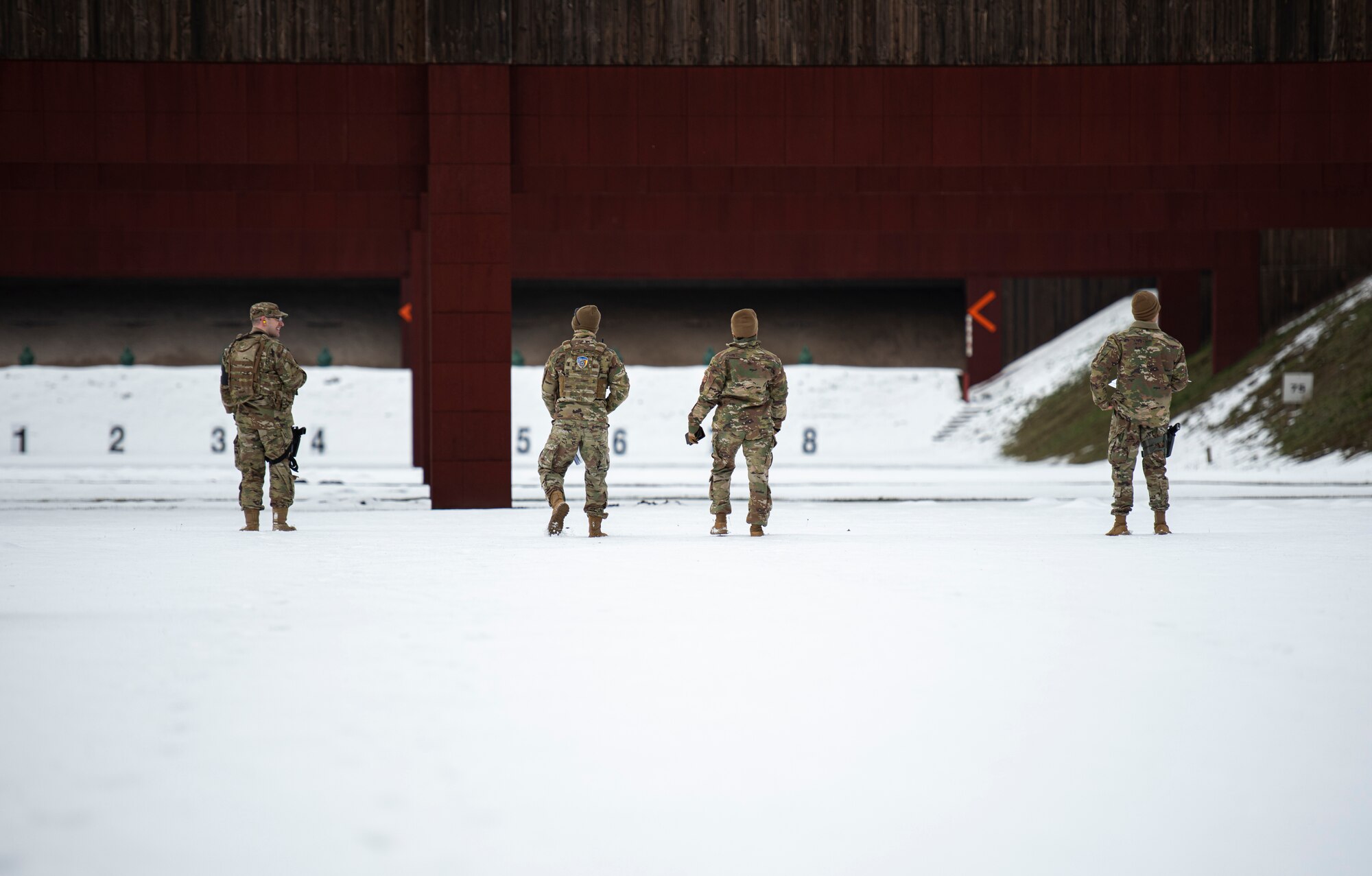 U.S. Air Force Airmen assigned to the 569th U.S. Forces Police Squadron walk to their next target range at Breitenwald Landstuhl Range, Germany, Jan. 20, 2021.