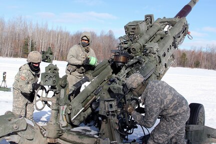 A gunnery team from C Battery, 1st/120th Field Artillery, Wisconsin National Guard, prepares to load and fire a M-777 Howitzer during Winter Strike 21 at Camp Grayling Maneuver Center, Mich., Jan. 25, 2021. Winter Strike 21 is a cold weather readiness event held as part of the Northern Strike exercise series that offers the Michigan National Guard’s unparalleled facilities as a venue for U.S. and coalition forces to receive advanced All-Domain joint fires training in all weather conditions.