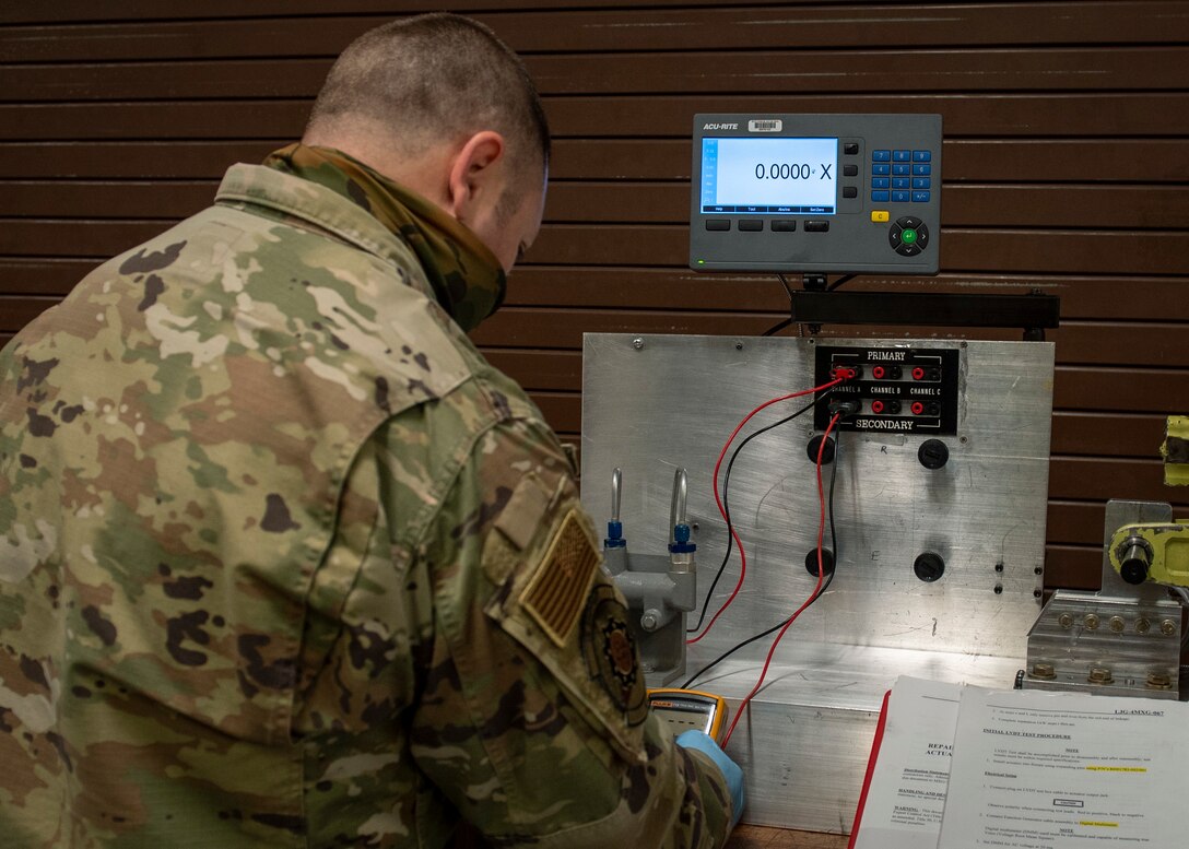 Staff Sgt. Steven Hall, 4th Component Maintenance Squadron centralized repair facility expeditor, calibrates a stabilator actuator test apparatus at Seymour Johnson Air Force Base, North Carolina, Jan. 7, 2021.