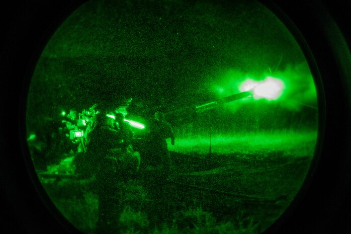 U.S. Marines and U.S. Army Soldiers with 25th Infantry Division fire an M777 Howitzer at Schofield Barracks, Hawaii, Jan. 21.