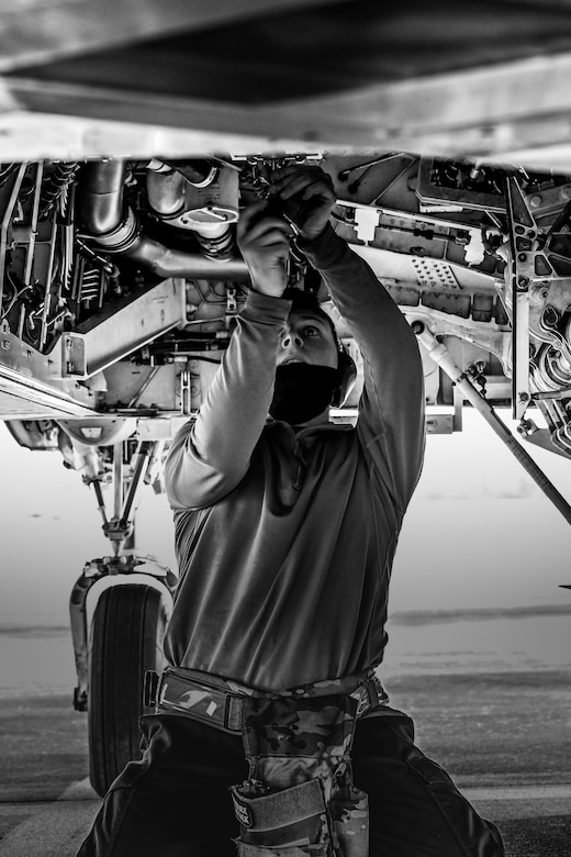 An Airmen works on an aircraft.