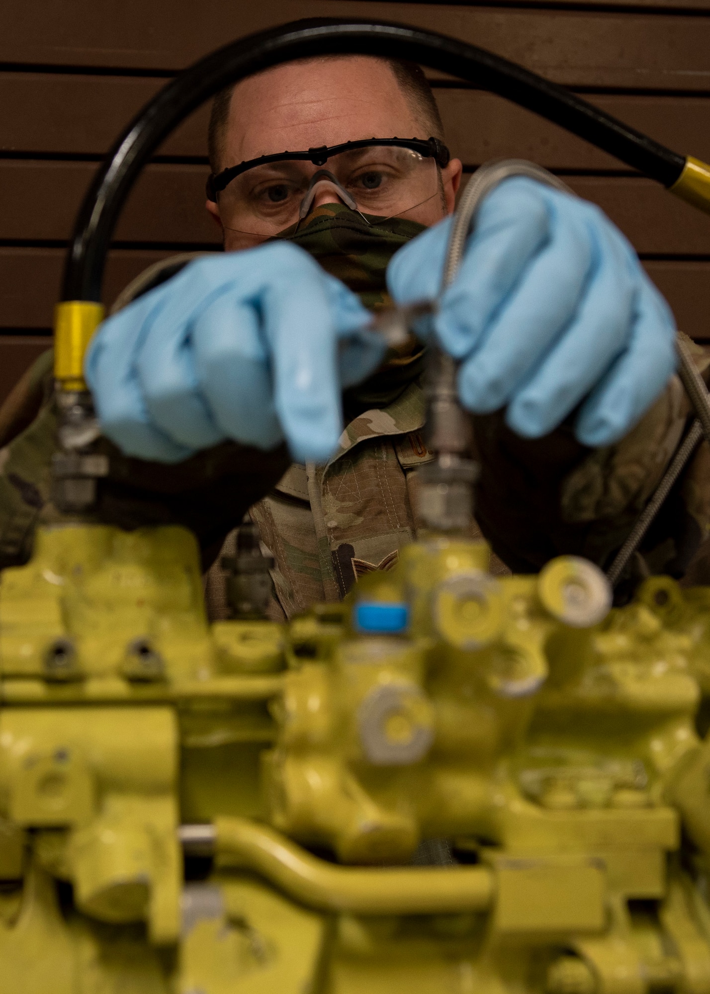 Staff Sgt. Steven Hall, 4th Component Maintenance Squadron centralized repair facility expeditor, connects a stabilator actuator to a test apparatus at Seymour Johnson Air Force Base, North Carolina, Jan. 7, 2021.
