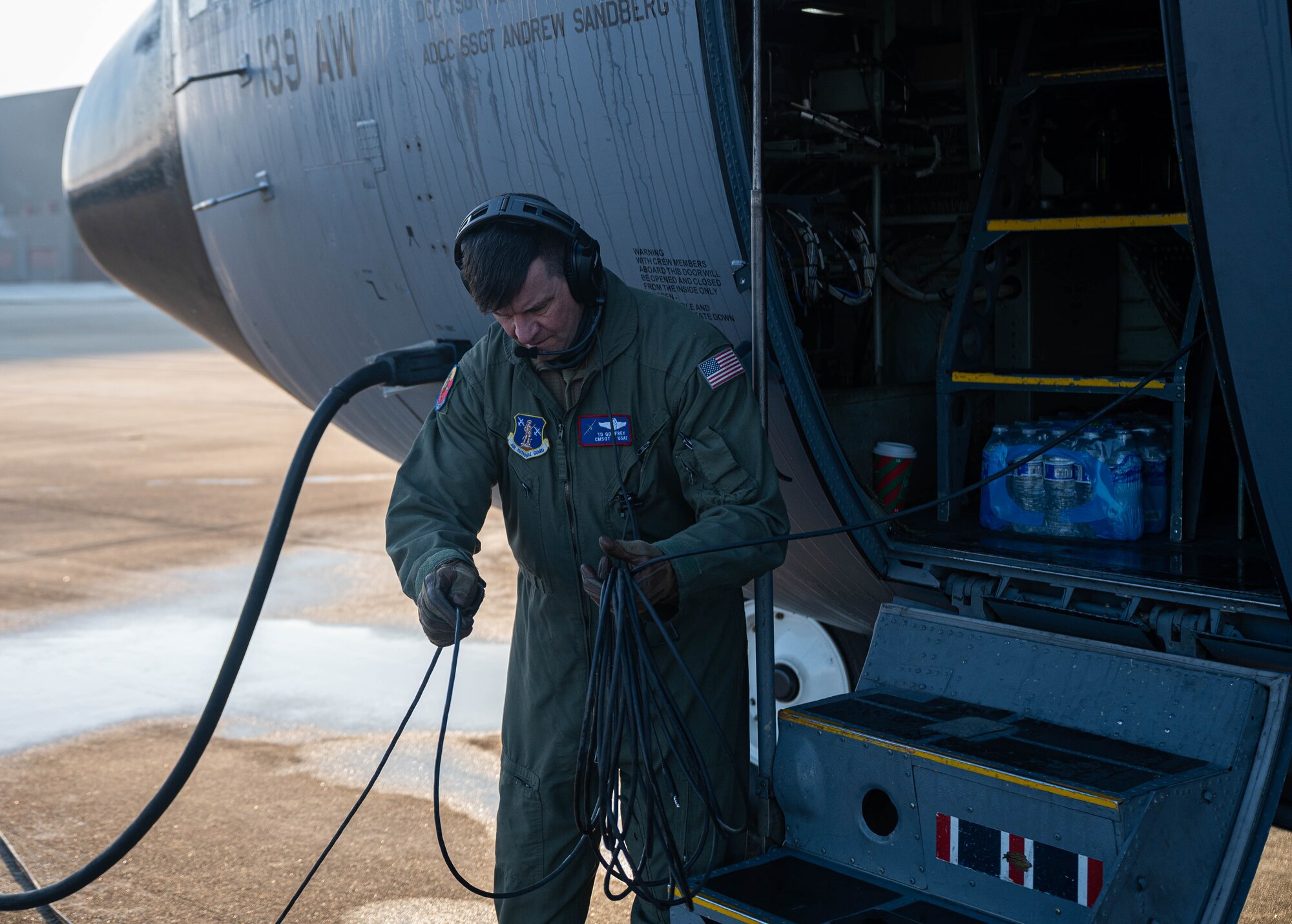 An Airman preps and aircraft.