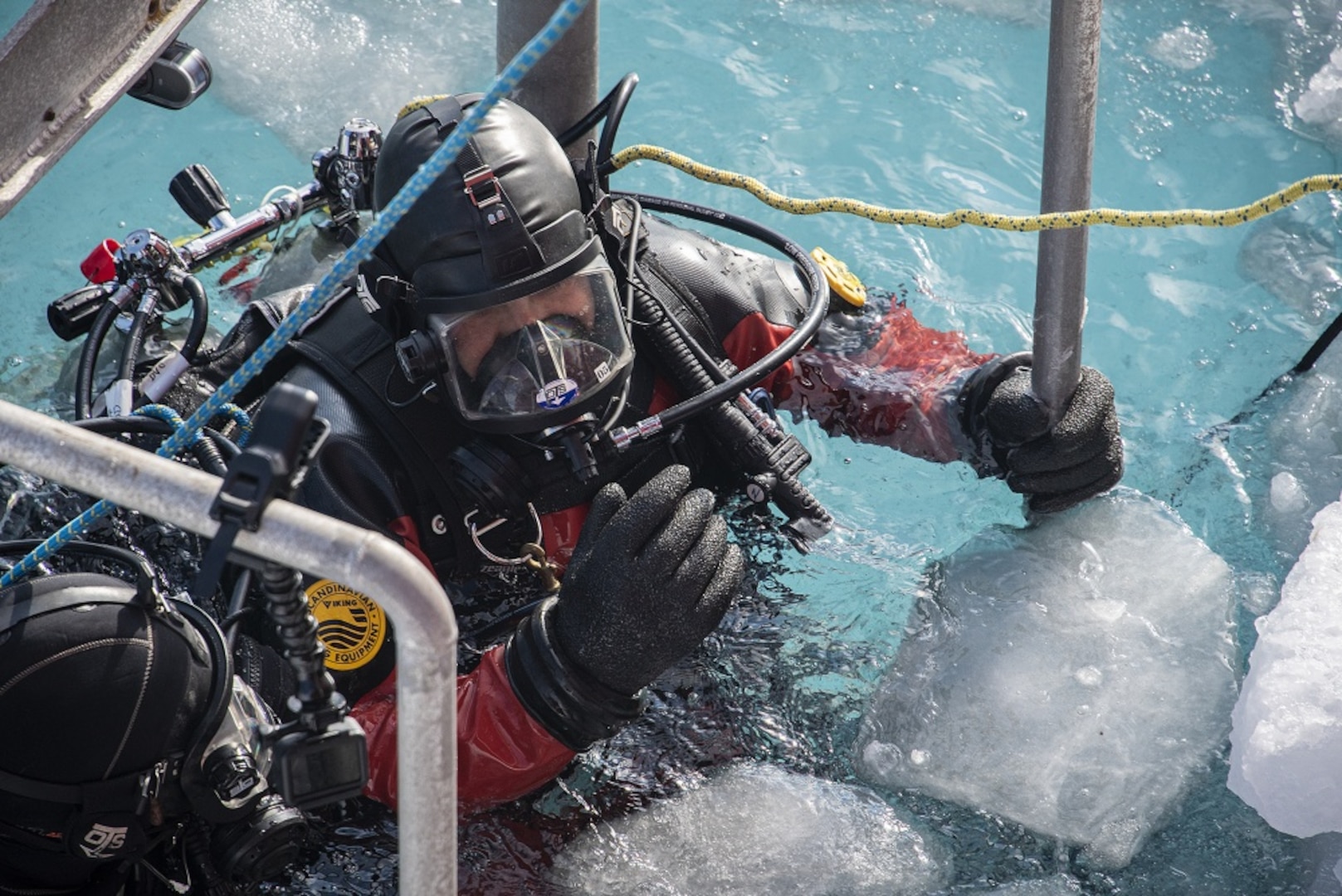 U.S. Coast Guard Petty Officer 1st Class Andres Murtillo enters the water Feb. 1, 2020, during a scuba dive about seven miles north of McMurdo Station, Antarctica. Scuba divers from the U.S. Coast Guard, U.S. Army and the Royal Canadian Navy are serving aboard the U.S. Coast Guard Cutter Polar Star (WAGB-10) in order to effect emergency repairs if needed to the 44-year-old heavy icebreaker. The crew of the Seattle-based Polar Star is working near Antarctica in support of Operation Deep Freeze 2020, the U.S. military’s contribution to the National Science Foundation-managed U.S. Antarctic Program. U.S. Coast Guard photograph by Senior Chief Petty Officer NyxoLyno Cangemi