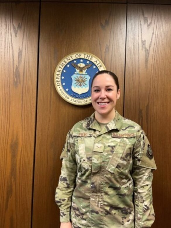Airman 1st Class Makayla Evans, 628th Air Base Wing Judge Advocate paralegal, poses in front of the United States Air Force seal Jan. 15, 2021 at Joint Base Charleston, S.C.