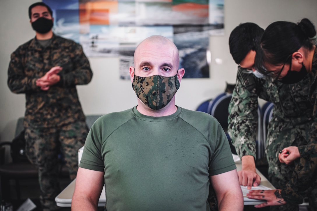 U.S. Marine Corps Sgt. Maj. Travis DeBarr, sergeant major of the 11th Marine Expeditionary Unit, waits to receive the Pfizer-BioNTech COVID-19 vaccine at Naval Hospital Camp Pendleton, California, Jan. 11, 2021. The 11th MEU is one of the first units with I Marine Expeditionary Force to be allocated the vaccine due to its upcoming deployment. The vaccine was authorized for emergency use by the U.S. Food and Drug Administration and is voluntary to receive. (U.S. Marine Corps photo by Staff Sgt. Donald Holbert)