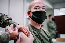 U.S. Marine Corps Lt. Col. Le Nolan, executive officer of the 11th Marine Expeditionary Unit, receives the Pfizer-BioNTech COVID-19 vaccine at Naval Hospital Camp Pendleton, California, Jan. 11, 2021. The 11th MEU is one of the first units with I Marine Expeditionary Force to be allocated the vaccine due to its upcoming deployment. The vaccine was authorized for emergency use by the U.S. Food and Drug Administration and is voluntary to receive. (U.S. Marine Corps photo by Staff Sgt. Donald Holbert)