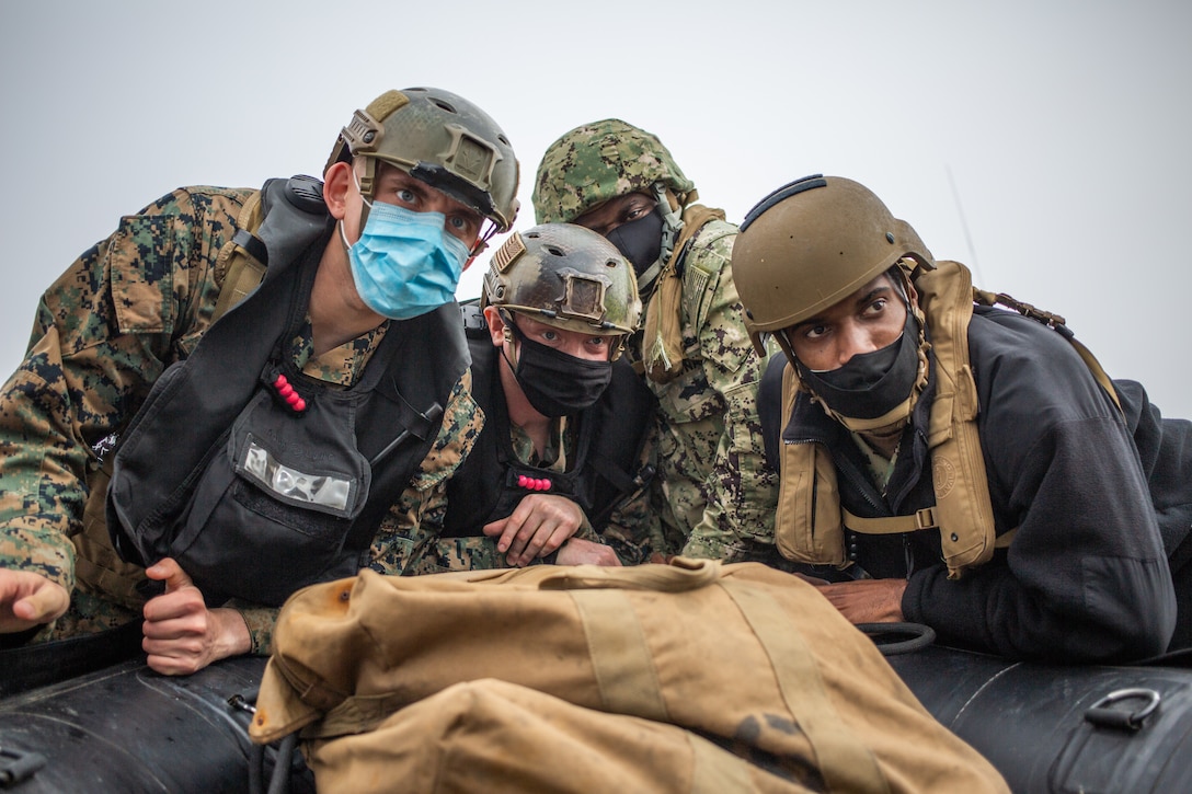 U.S. Marines with the All Domain Reconnaissance Detachment, 11th Marine Expeditionary Unit and U.S. Sailors with Maritime Expeditionary Security Squadron 3, operate a Combat Rubber Raid Craft (CRRC) during a combatant dive exercise at Marine Corps Base Camp Pendleton, California, Jan. 6, 2020. The training improved proficiency utilizing CRRCs for insertion and extraction during combatant dive operations, and improved interoperability working with the Mark VI patrol boat platform to facilitate potential special mission requirements on the 11th MEU’s upcoming deployment. (U.S. Marine Corps photo by Sgt. Jennessa Davey)