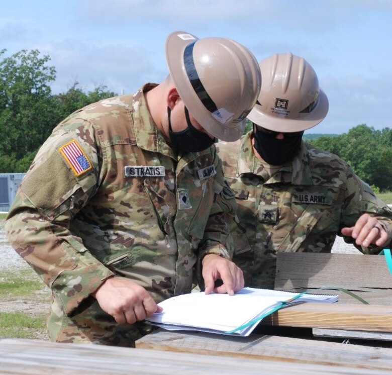 Spc. Dylan Stratis and Sgt. Robert Keys, U.S. Army Prime Power School students, review an electrical schematic design and discuss ways to troubleshoot a power outage scenario during the Prime Power Capstone Training Exercise at the Contingency Basing Integration Training and Evaluation Center (CBITEC) in Fort Leonard Wood, Mo., Aug. 11, 2020. Prime Power School students are tested at the CBITEC on the knowledge, skills and abilities they gained over the year-long course to become prime power specialists. CBITEC is a U.S. Army Engineer Research and Development Center, Construction Engineering Research Laboratory facility that supports the operational energy continuum and safely trains the warfighter to tackle the nation’s power challenges.