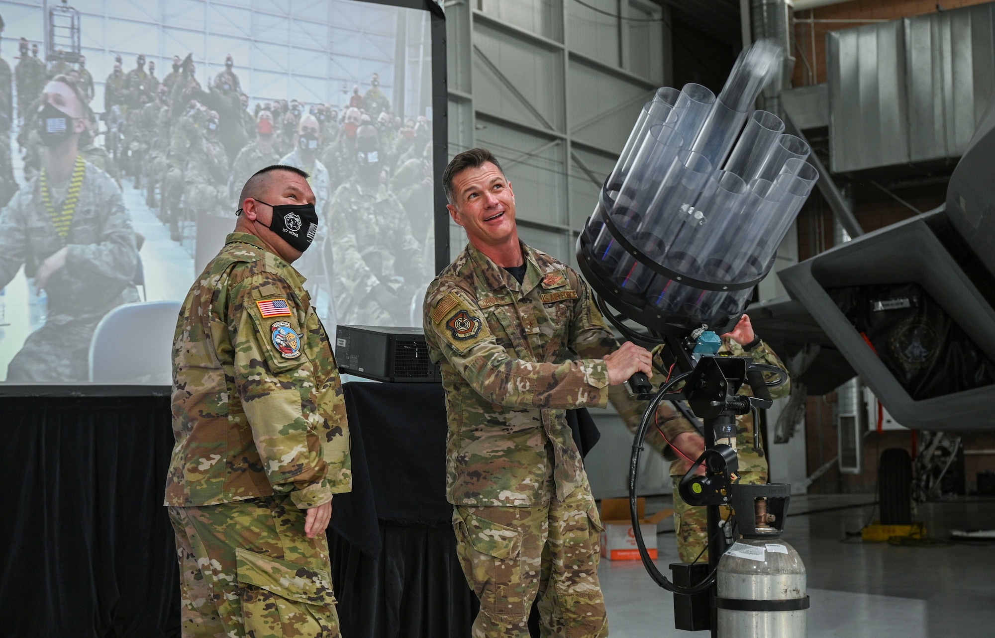 Brig. Gen. Drowley shoots out t-shirts to Airmen.