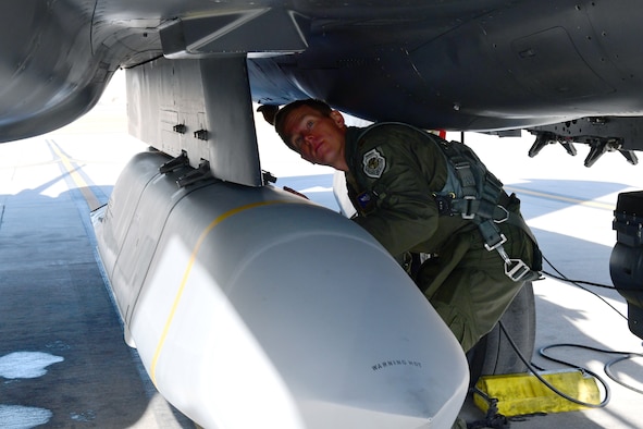 Maj. Ryan Mobley, 706th Fighter Squadron assistant director of operations and F-15E test director, prepares to conduct an AGM-158B Joint Air-to-Surface Standoff Missile drop from an F-15E, Jan. 7, Nellis Air Force Base, Nev. While the F-15E is the leading delivery platform for JASSM in the Area of Responsibility, the missile release at White Sands Missile Range, New Mexico, was the first JASSM dropped by any unit from Nellis AFB.