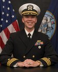 Studio portrait of Cmdr. Adam S. Miller