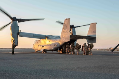 U.S. Marines with 3rd Battalion, 1st Marines, assigned to Special Purpose Marine-Air Ground Task Force – Crisis Response - Central Command, board an MV-22 Osprey during a crisis response exercise in Kuwait, Jan. 13, 2021. The regularly scheduled exercise was designed to sustain proficiency and enhance MAGTF integration in a realistic training environment. The SPMAGTF-CR-CC is a crisis response force, prepared to deploy a variety of capabilities across the region.  (U.S. Marine Corps Photo by Lance Cpl. Jacob Yost)
