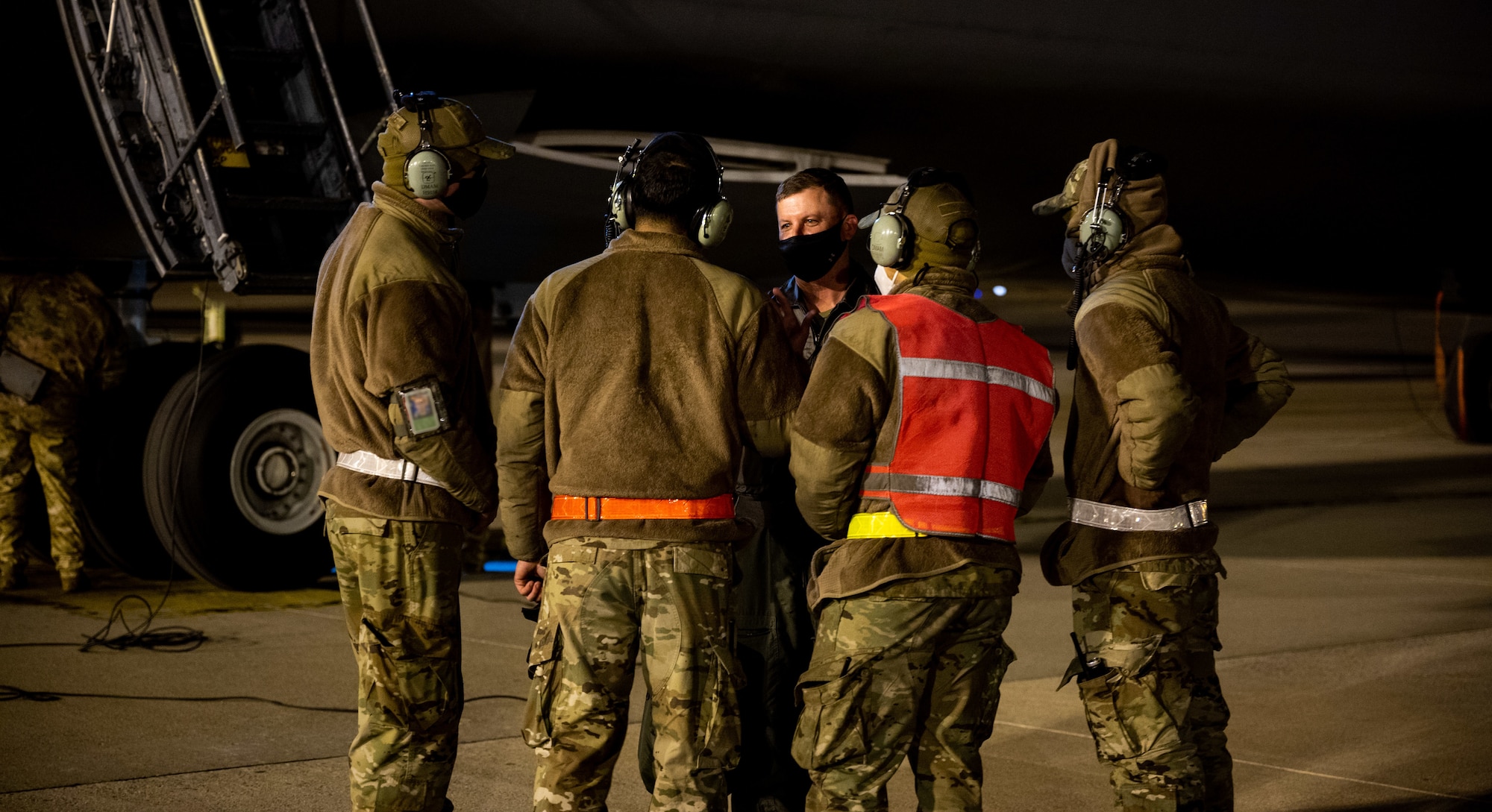 Col. Matthew Jones, 436th Airlift Wing commander, talks with Airmen from the  436th Aircraft Maintenance Squadron after completing a training sortie on Jan. 19, 2021, at Dover Air Force Base, Delaware. Dover AFB supports 20 percent of the nation’s strategic airlift and routinely flies local training missions to sustain mission readiness for global operations. (U.S. Air Force photo by Airman 1st Class Faith Schaefer)