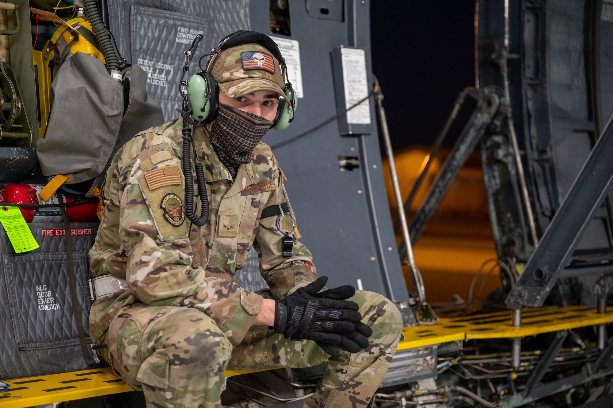 Following a preflight maintenance inspection, Airman 1st Class Michael Beil, 436th Aircraft Maintenance Squadron crew chief, sits near the crew entry door of a C-5M Super Galaxy at Dover Air Force Base, Delaware, Jan. 19, 2021. Dover AFB supports  20% of the nation’s strategic airlift and routinely flies local training missions to sustain mission readiness for global operations. (U.S. Air Force photo by Airman 1st Class Faith Schaefer)