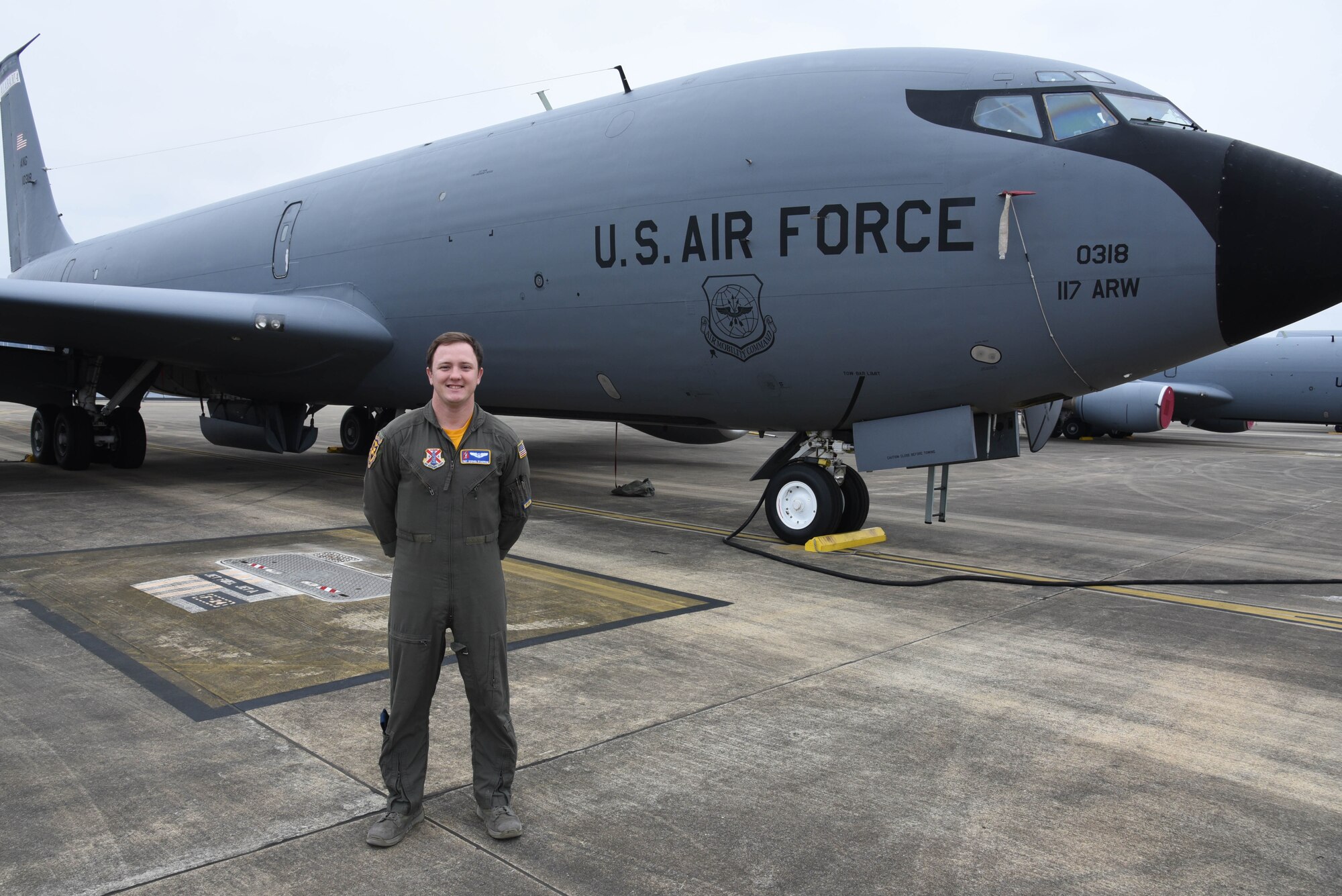 Air National Guard Tech. Sgt. Stephen Standridge, boom operator poses next to a KC-135 Stratotanker at Sumpter Smith JNGB, Alabama January 9, 2021. (U.S. Air National Guard photo by Airman 1st Class Nicholas Faddis)