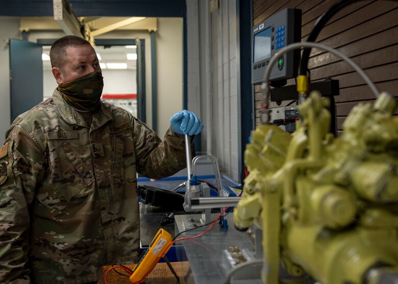 Staff Sgt. Steven Hall, 4th Component Maintenance Squadron centralized repair facility expeditor, tests a stabilator actuator at Seymour Johnson Air Force Base, North Carolina, Jan. 7, 2021.
