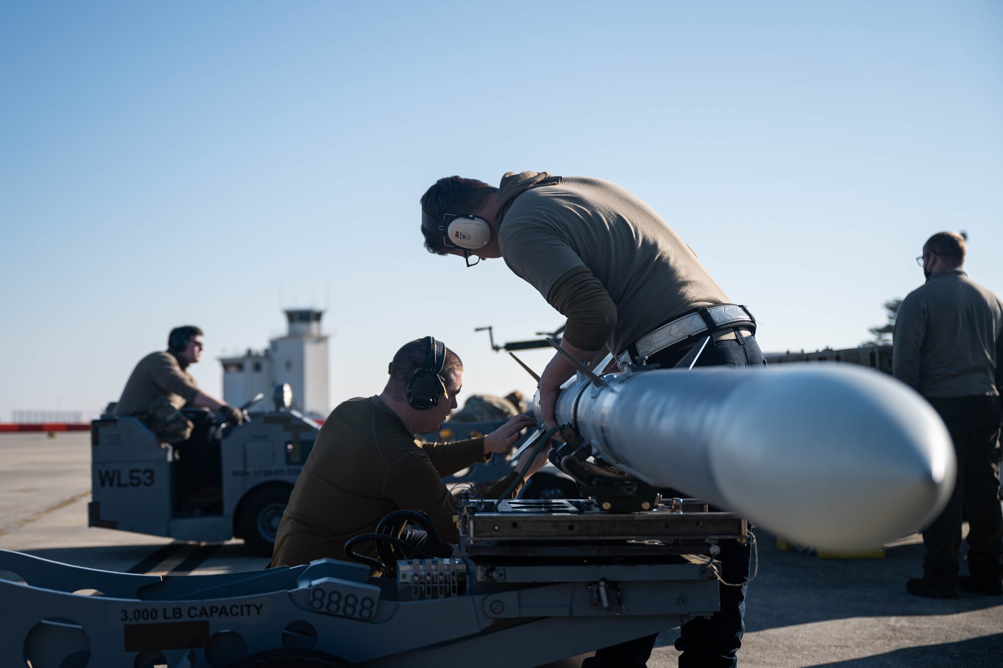 Airmen prepare ammunition for a training exercise.