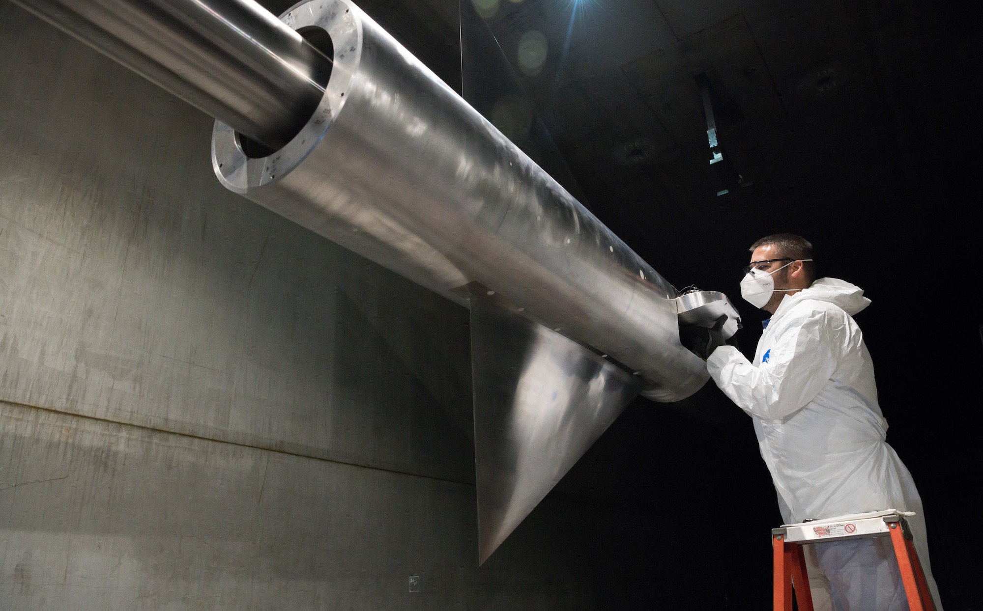 Bradley Rogers, lead outside machinist, removes a hatch to access the interior of an AGARD-B model in the 16-foot supersonic wind tunnel at Arnold Air Force Base, Tenn., Jan. 18, 2021. (U.S. Air Force photo by Jill Pickett)