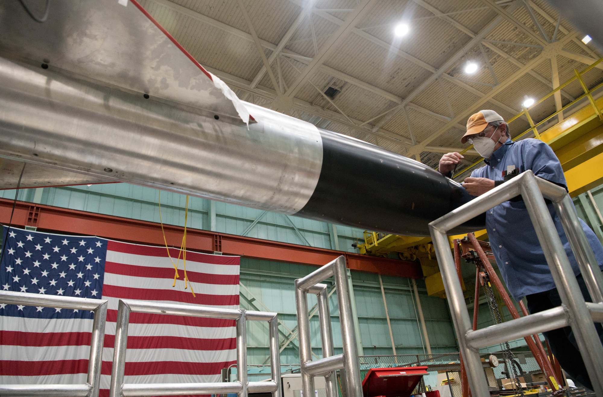 ale McKill, an outside machinist, makes incremental adjustments to an AGARD-B model to ensure the surface is as smooth as possible where access covers are located, Jan. 8, 2021, at Arnold Air Force Base, Tenn. (U.S. Air Force photo by Jill Pickett)