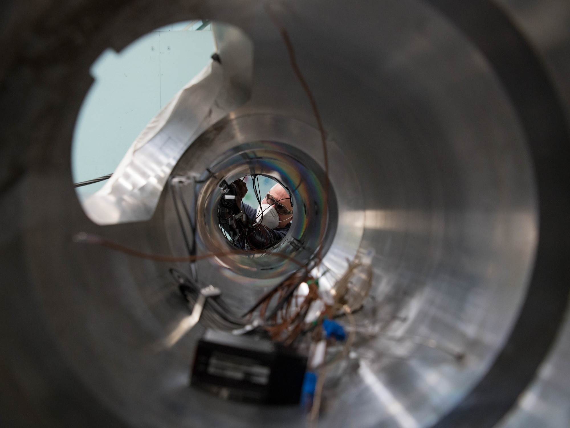 Darrell Gagnon, an outside machinist, secures instrumentation inside the body of an AGARD-B model while preparing to install the model on a sting, Jan. 4, 2021, at Arnold Air Force Base, Tenn. (U.S. Air Force photo by Jill Pickett)