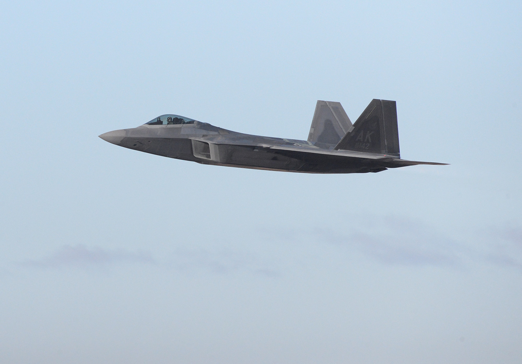 Maj. Philip “Stonewall” Johnson, 514th Flight Test Squadron F-22 test pilot, departs Hill Air Force Base, Utah, Nov. 24, 2020, on a functional check flight in the last F-22 Raptor to complete the F-22 Structural Repair Program. The 574th Aircraft Maintenance Squadron processed 247 F-22s through the program by performing structural modifications to increase total flying hour serviceability on each aircraft by 8,000 hours. (U.S. Air Force photo by Alex R. Lloyd)