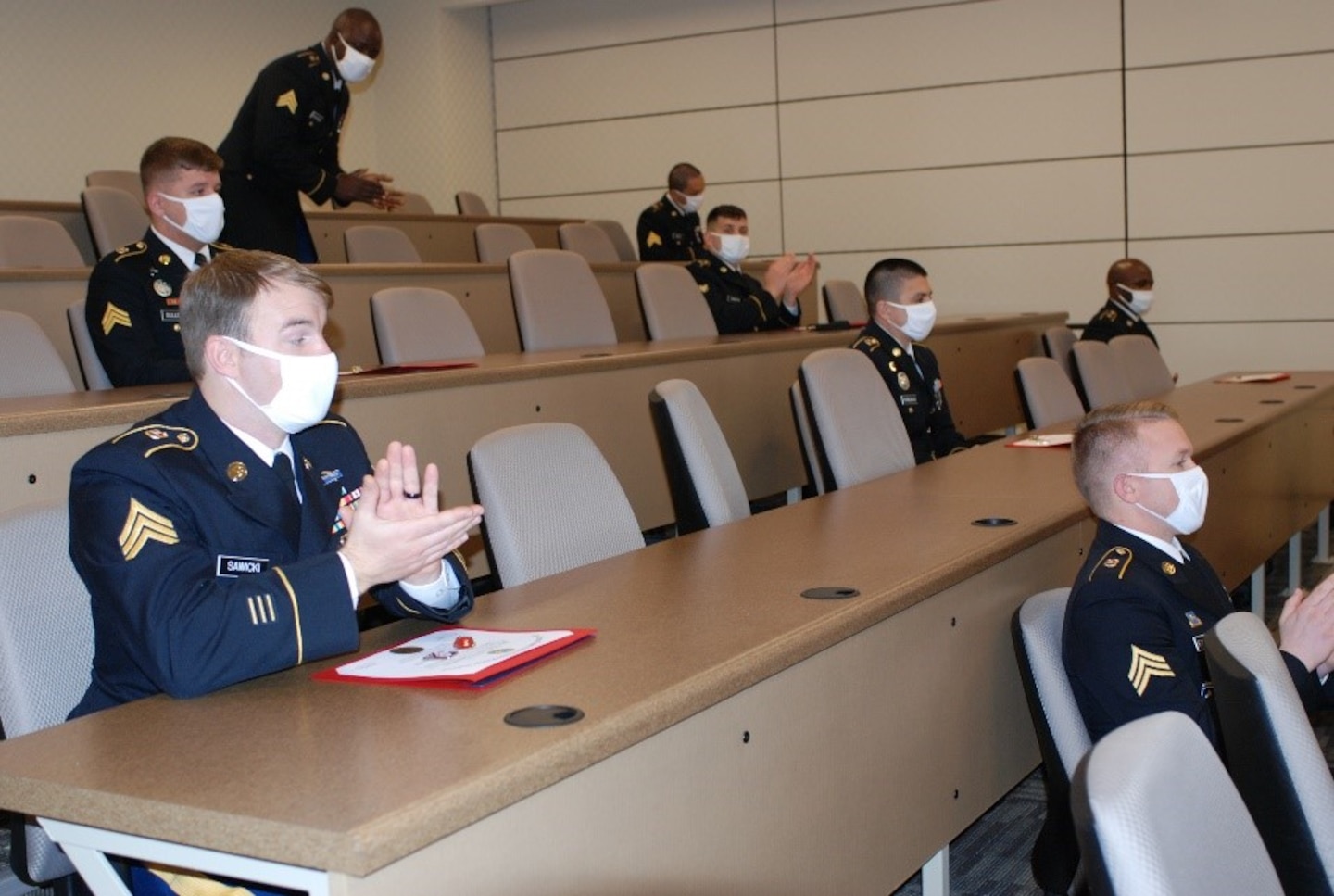 U.S. Army Prime Power School students applaud their peers during the virtual graduation ceremony held at the Digital Training Center, Fort Leonard Wood, Mo., Dec. 15, 2020. During the ceremony, 13 Prime Power School students received certificates acknowledging completion of a rigorous year-long training course focused on building the students’ knowledge, skills and abilities to help support the operational energy continuum and safely solve the nation’s power challenges.