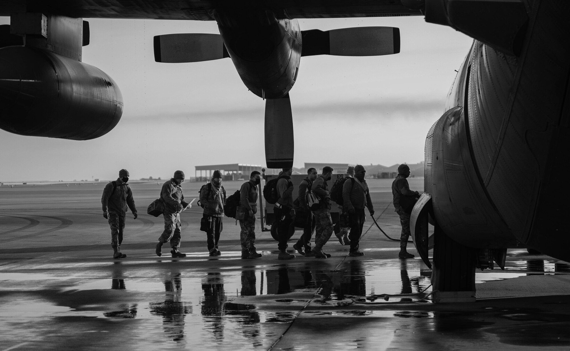 Airmen board an aircraft to take them to conduct an exercise.