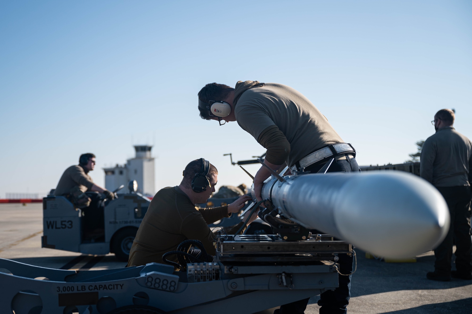 Airmen prepare ammunition for a training exercise.