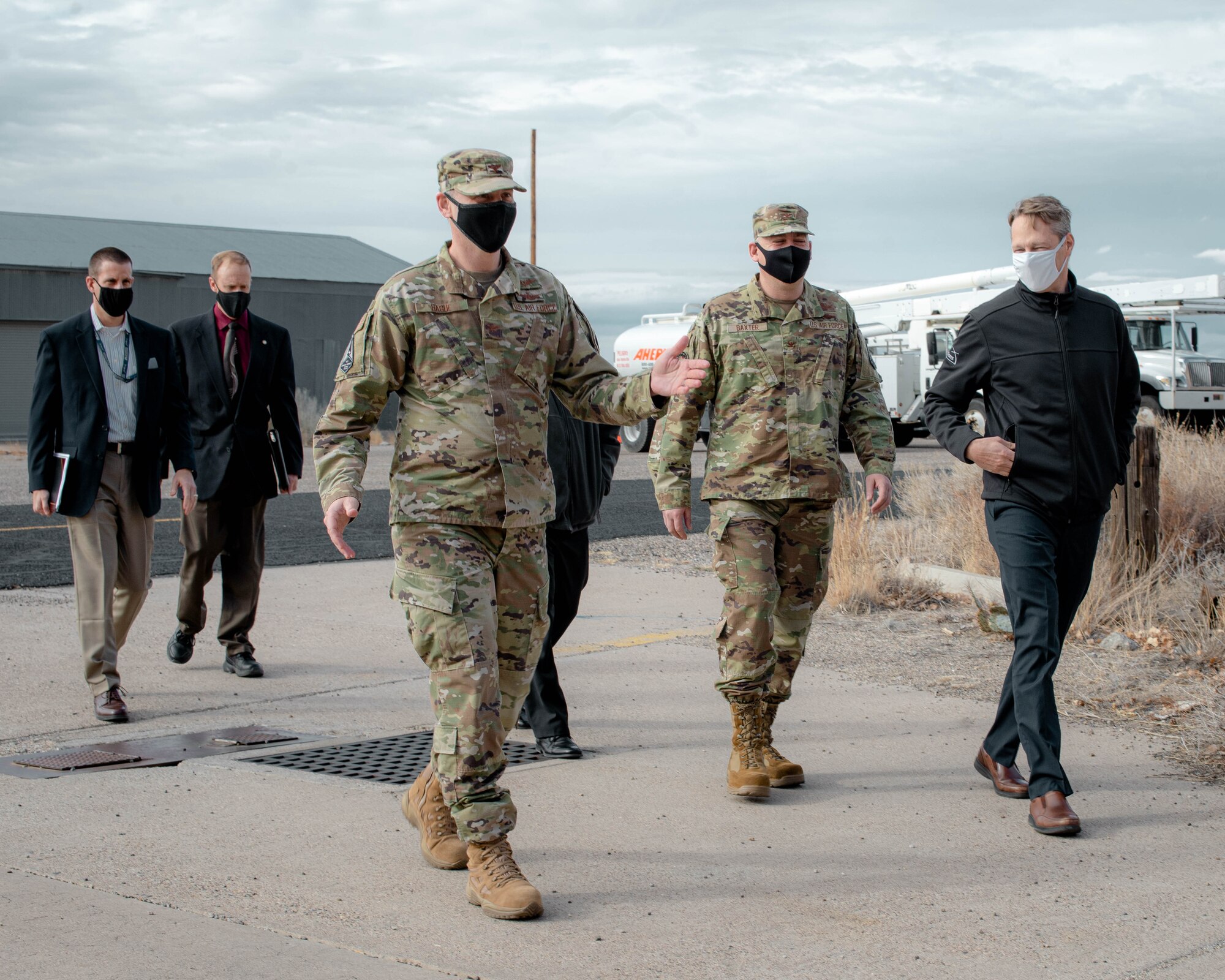 Air Force Research Laboratory scientists escort Col. Nick Hague and his U.S. Space Force team into Manzano Mountain, one of Air Force Research Laboratory’s controlled test environments. (U.S. Air Force photo/Macee Hunt)