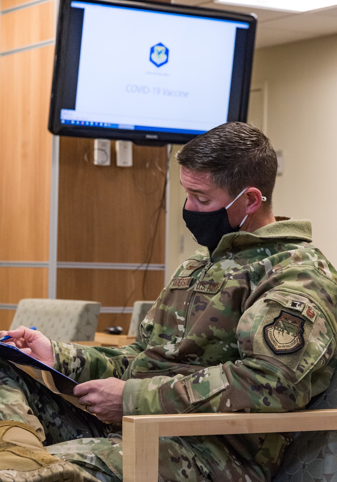 Col. Shanon Anderson, 436th Airlift Wing vice commander, signs consent forms prior to receiving a COVID-19 vaccination Jan. 20, 2021, at Dover Air Force Base, Delaware. Anderson was among the first Team Dover senior leaders who voluntarily received the vaccine in accordance with Department of Defense guidance. The vaccine was granted emergency use authorization by the U.S. Food and Drug Administration for use in prevention of COVID-19. (U.S. Air Force photo by Roland Balik)