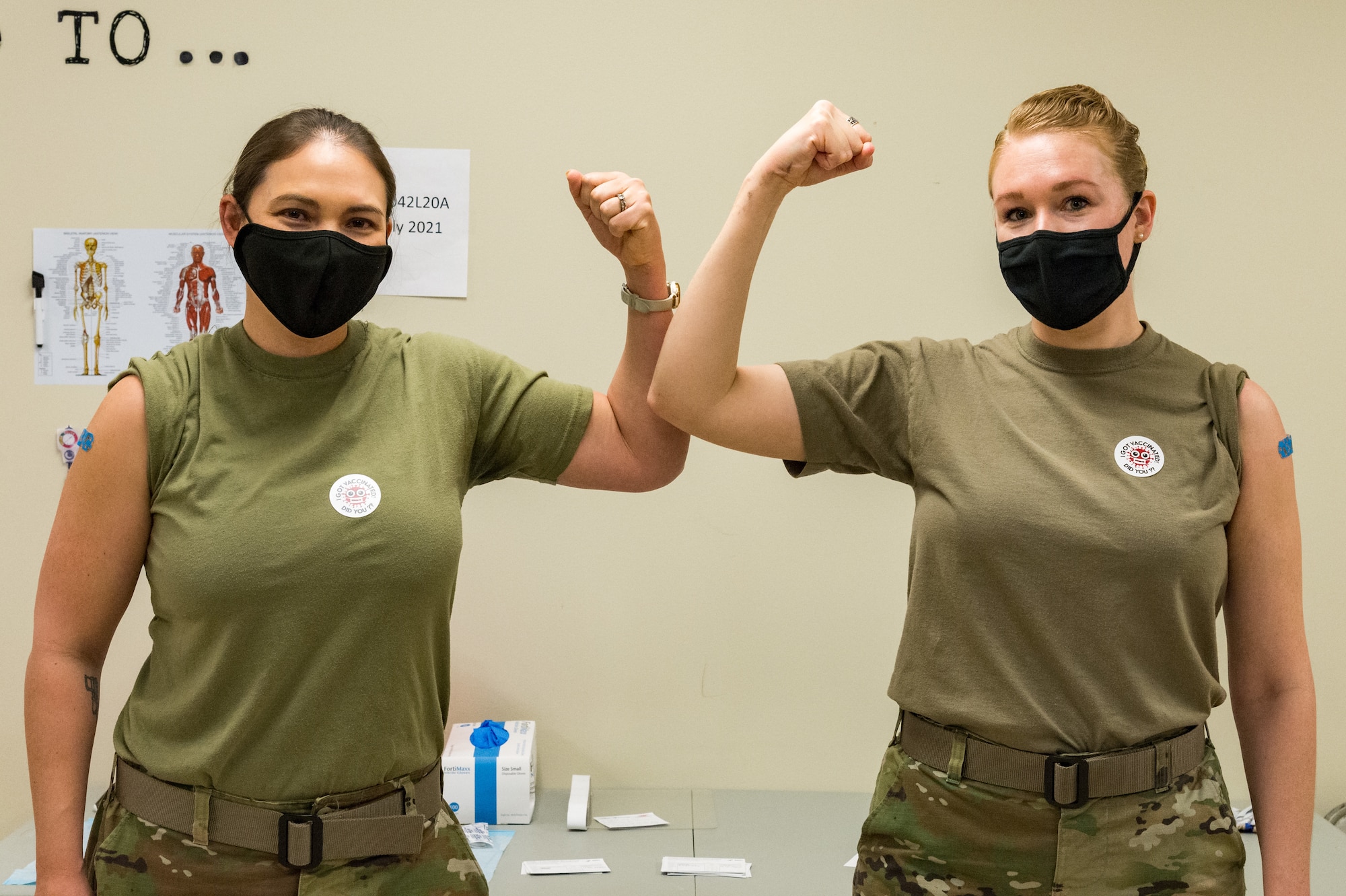 Lt. Col. Kristen Carter, 436th Medical Support Squadron commander, and Master Sgt. Jessica Nienhueser, 436th MDSS superintendent, pose for a photo after receiving the COVID-19 vaccination Jan. 21, 2021, at Dover Air Force Base, Delaware. Carter and Nienhueser were among the first Team Dover front-line workers who voluntarily received the vaccine in concurrence with Department of Defense guidance. The vaccine was granted emergency use authorization by the U.S. Food and Drug Administration for use in prevention of COVID-19. (U.S. Air Force photo by Roland Balik)
