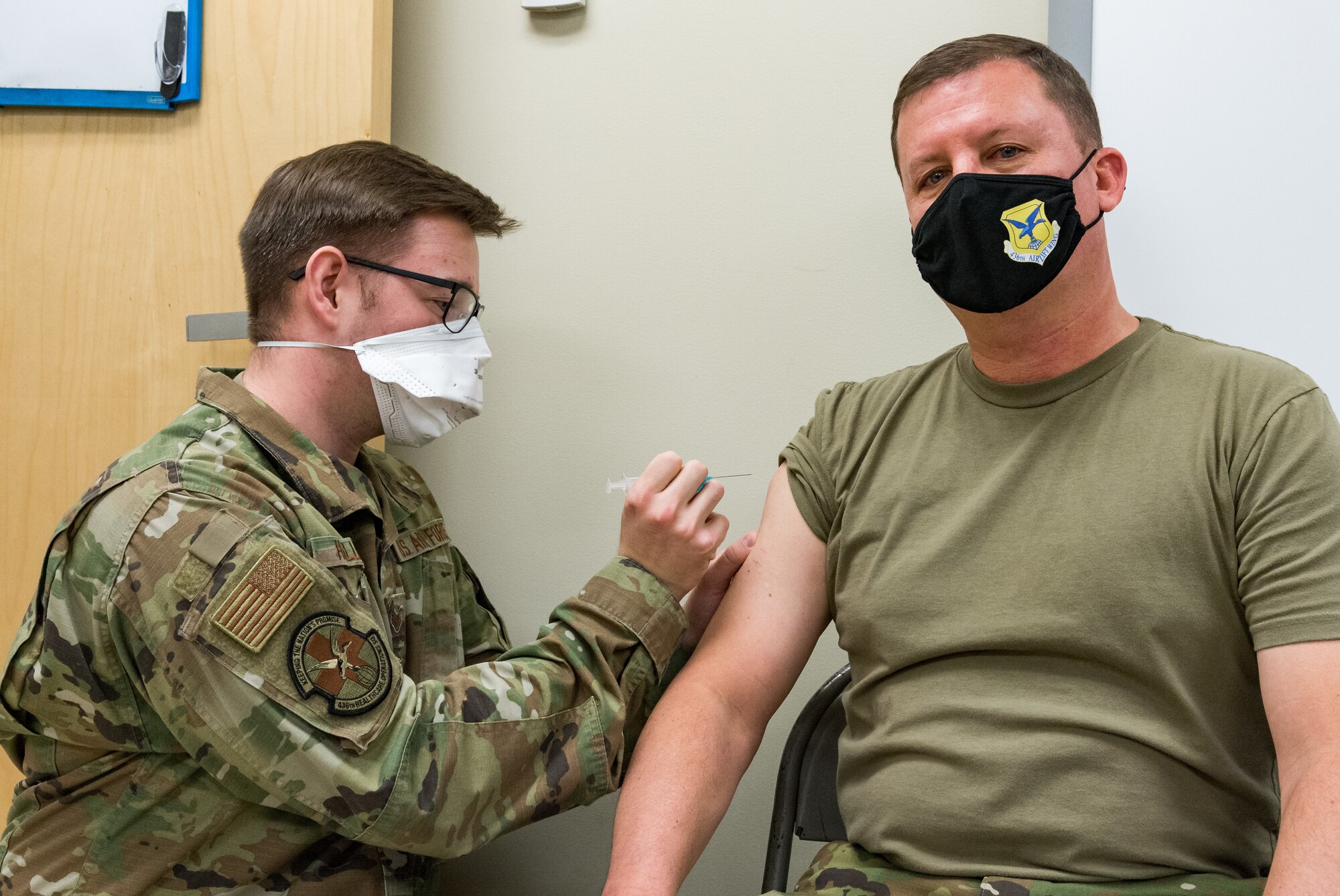 Col. Matthew Jones, 436th Airlift Wing commander, receives the COVID-19 vaccine administered by Staff Sgt. Logan Hallman, 436th Healthcare Operations Squadron education and training noncommissioned officer in charge, Jan. 22, 2021, at Dover Air Force Base, Delaware. Jones was among the first Team Dover senior leaders who voluntarily received the vaccine in accordance with Department of Defense guidance. (U.S. Air Force photo by Roland Balik)