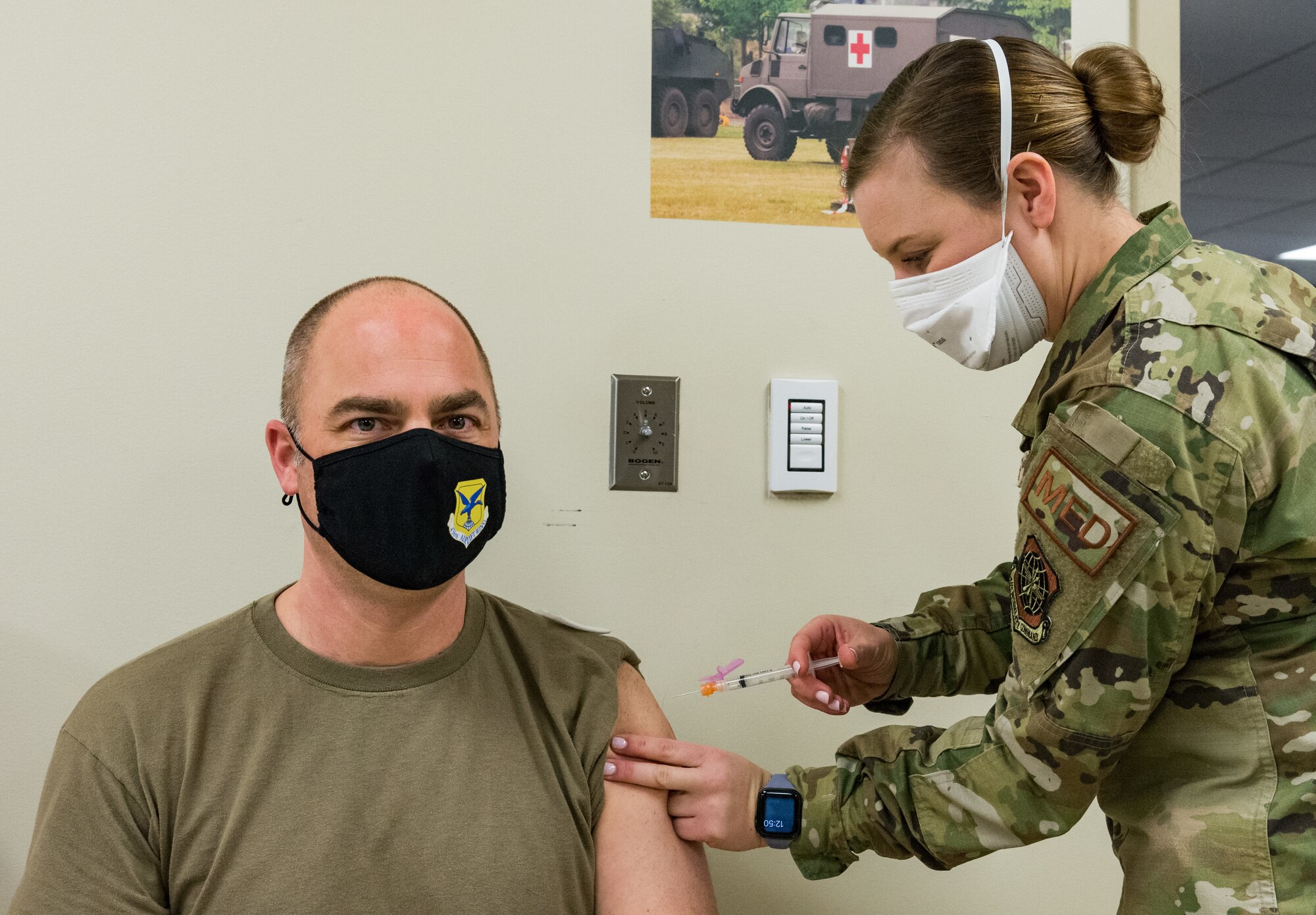 Chief Master Sgt. Jeremiah Grisham, 436th Airlift Wing interim command chief, receives the COVID-19 vaccine administered by Staff Sgt. Kelsey Loeser, 436th Medical Group unit training manager, Jan. 22, 2021, at Dover Air Force Base, Delaware. Grisham was among the first of Team Dover senior leaders who voluntarily received the vaccine in accordance with Department of Defense guidance. The vaccine was granted emergency use authorization by the U.S. Food and Drug Administration for use in prevention of COVID-19. (U.S. Air Force photo by Roland Balik)