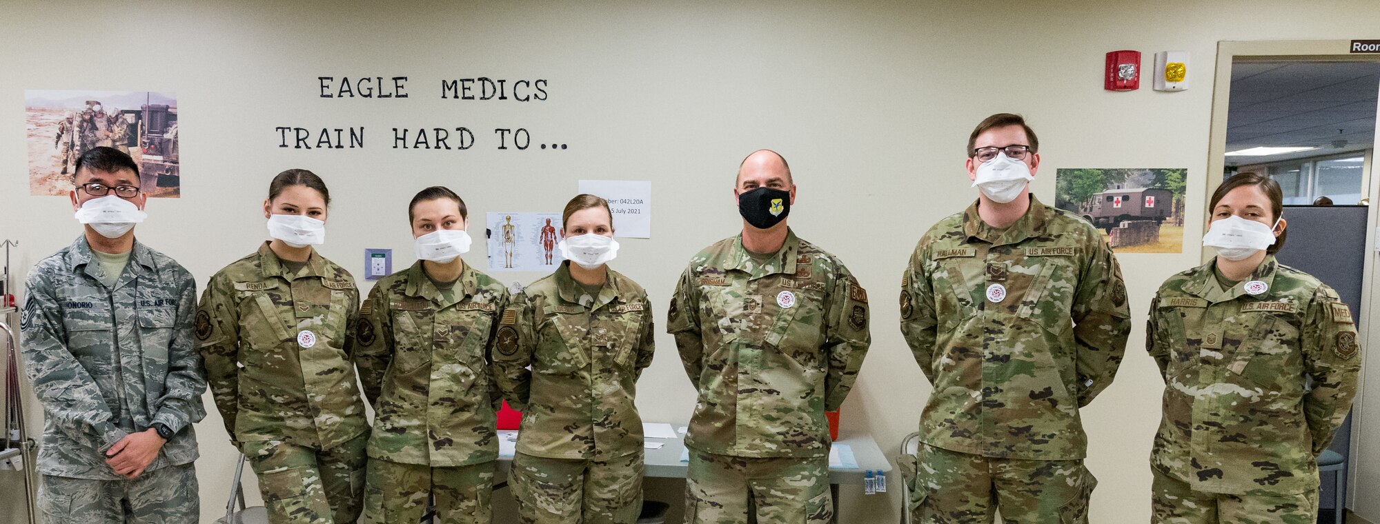 Chief Master Sgt. Jeremiah Grisham, 436th Airlift Wing interim command chief, poses for a photo with 436th Medical Group personnel who are tasked with administering the COVID-19 vaccine Jan. 22, 2021, at Dover Air Force Base, Delaware. Grisham was among the first Team Dover senior leaders who voluntarily received the vaccine in accordance with Department of Defense guidance. (U.S. Air Force photo by Roland Balik)