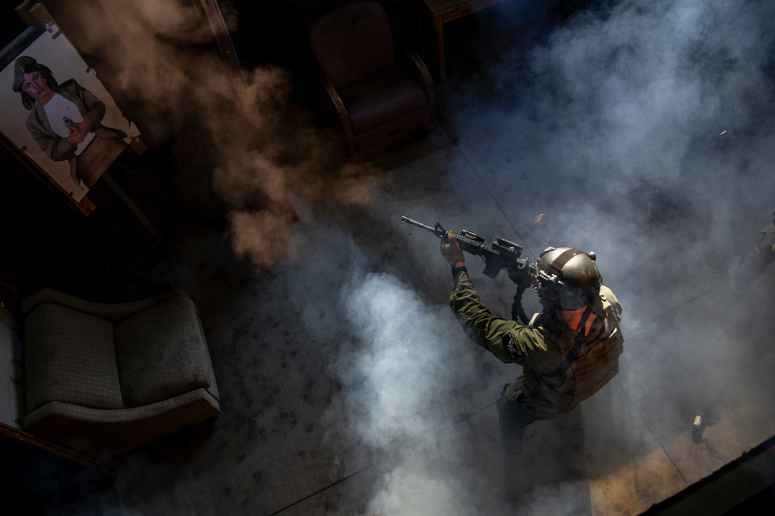 A U.S. Marine fires an M4A1 service rifle during a live-fire shoot house training at the Los Angeles Police Academy, Calif., Jan. 21.