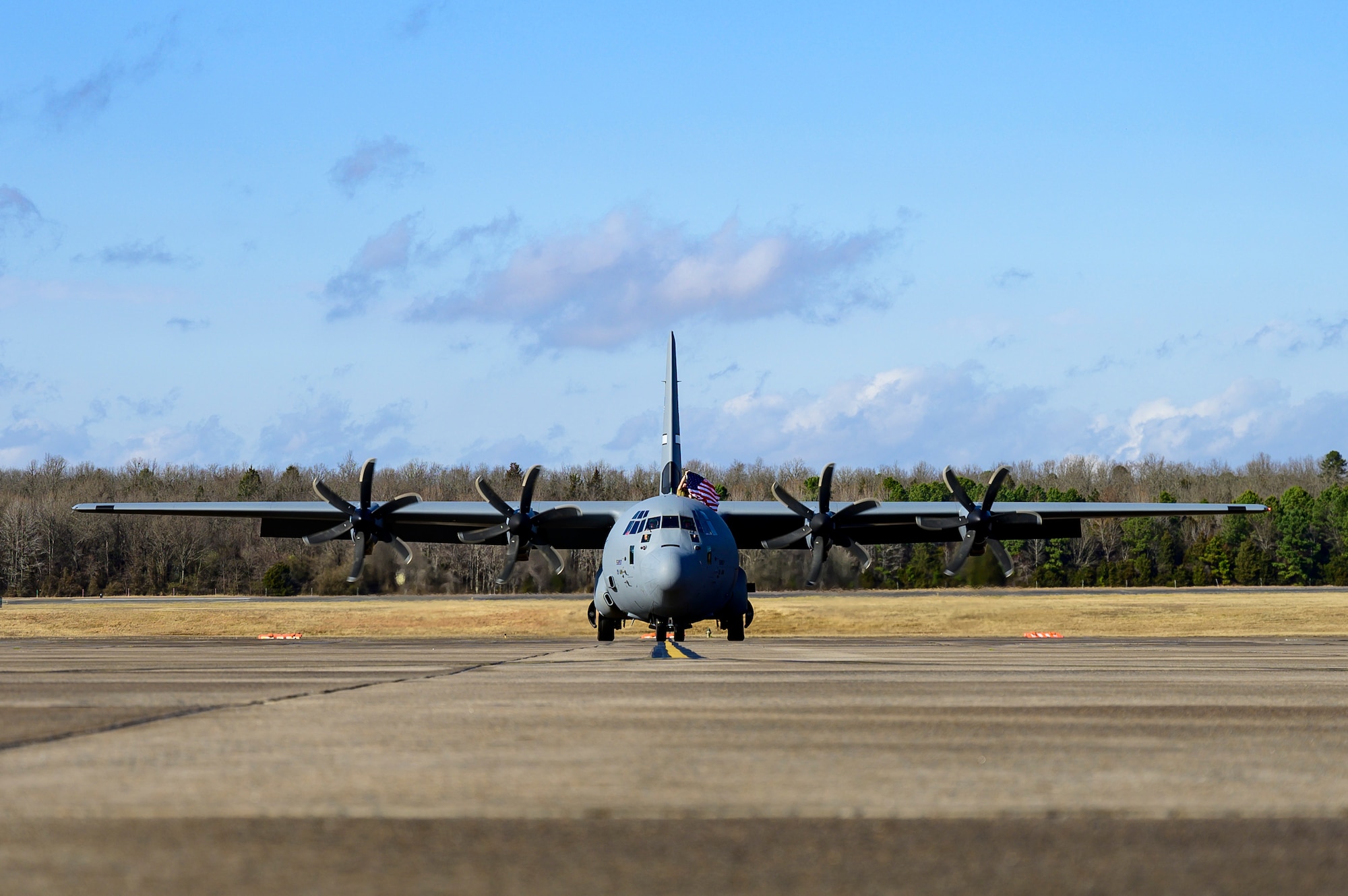 An aircraft taxis into its parking spot