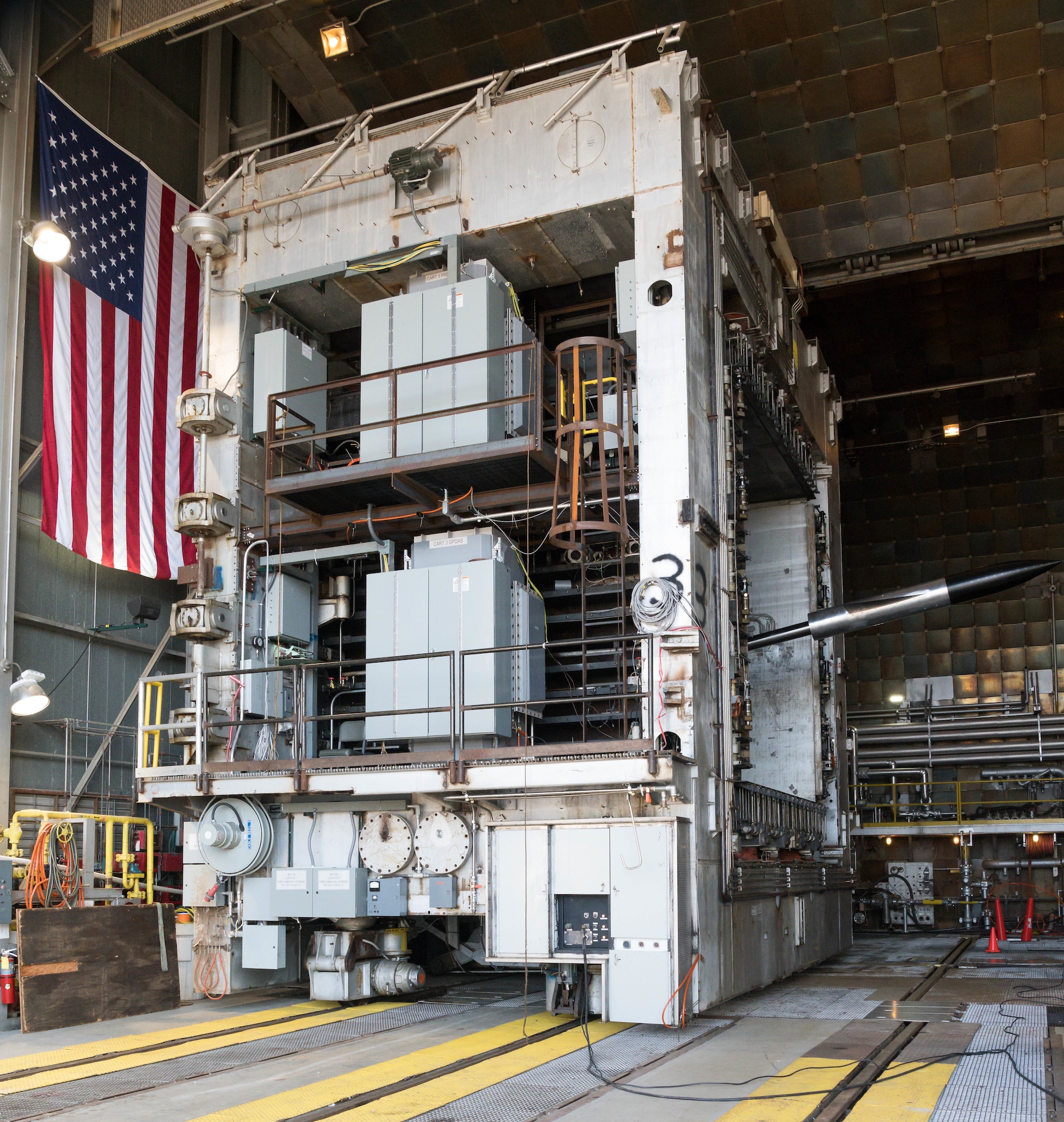 A test cart with an AGARD-B model installed is moved into the 16-foot supersonic wind tunnel, Jan. 12, 2021, at Arnold Air Force Base, Tenn. AGARD-B is a standard model used in wind tunnels to generate data that can be compared across wind tunnels. (U.S. Air Force photo by Jill Pickett)