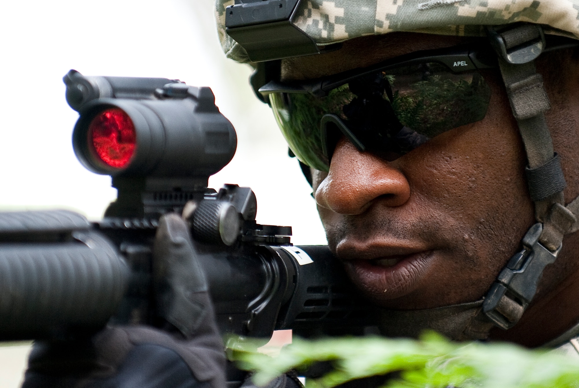Staff Sgt. Austin Esotu, a member of the 122nd Security Forces Squadron, 122nd Fighter Wing, Fort Wayne, Ind., keeps an eye out for enemy combatants during a reconnaissance exercise, July 28, 2015, at the Combat Readiness Training Center, Alpena, Mich. Airmen from the 122nd Fighter Wing were training at the CRTC as part of their annual training. (U.S. Air National Guard photo by Staff Sgt. William Hopper)