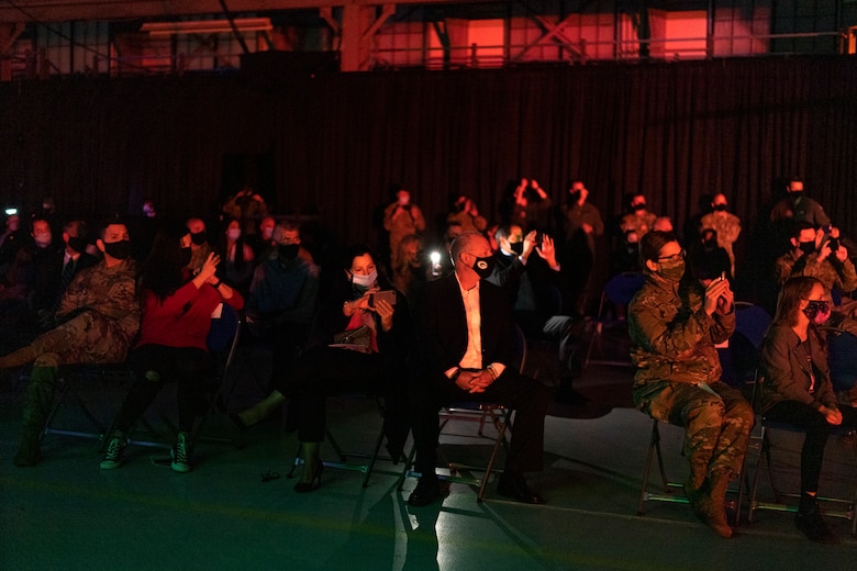 A photo of veterans taking photos during a ceremony