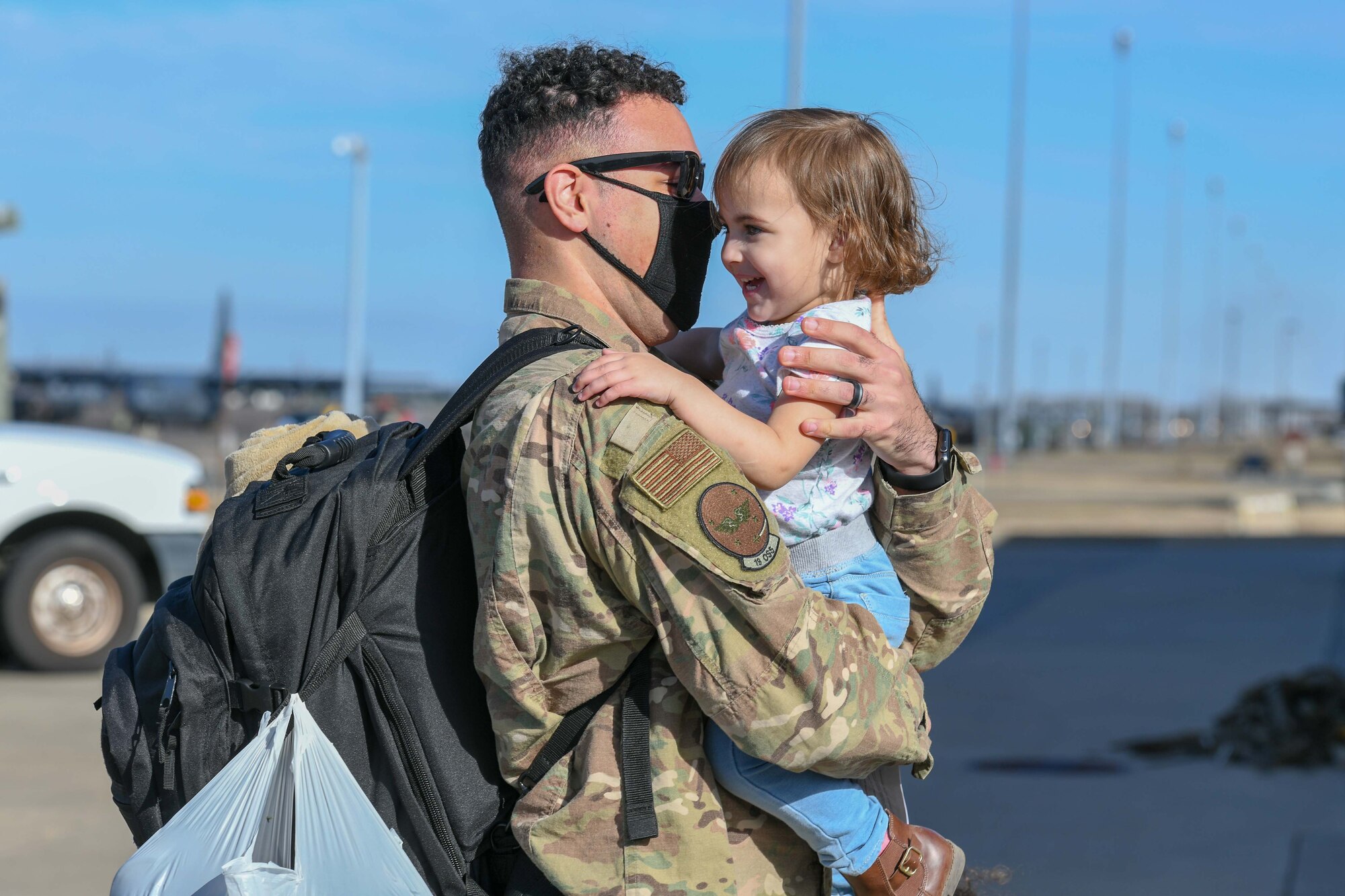 A father holds his daughter