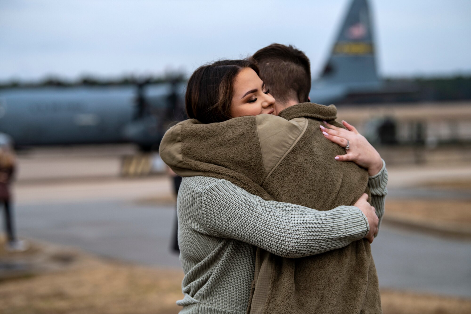 Two people embrace