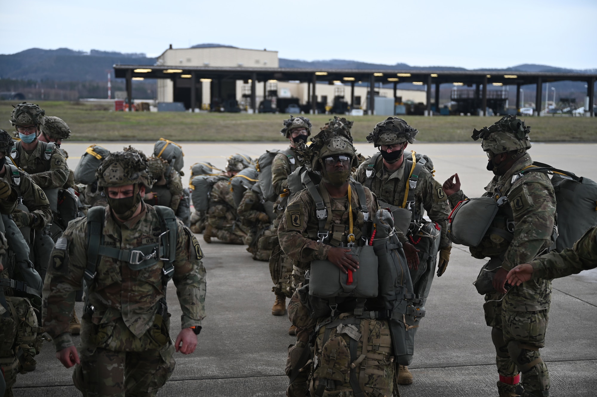 U.S. Army paratroopers assigned to the 1st Squadron (Airborne), 91st Cavalry Regiment, 173rd Airborne Brigade, assigned to Grafenwoehr Training Area, Germany, prepare to board a C-130J Super Hercules aircraft.