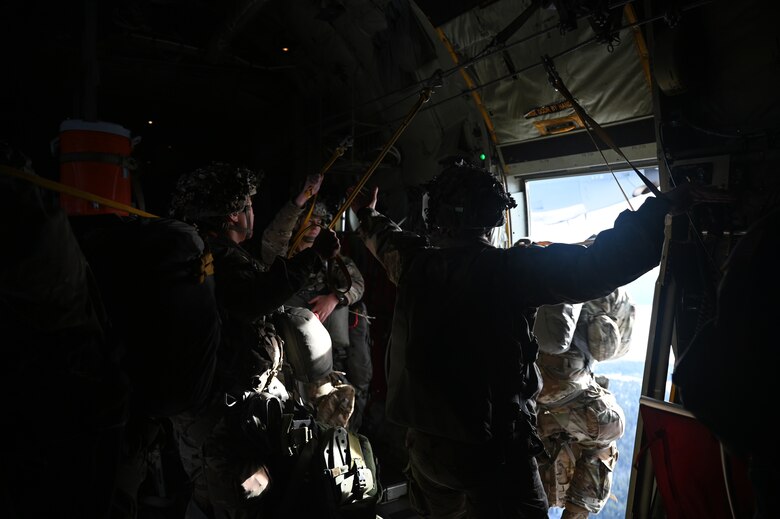 U.S. Army paratroopers assigned to the 1st Squadron (Airborne), 91st Cavalry Regiment, 173rd Airborne Brigade, assigned to Grafenwoehr Training Area, Germany, jump out of a U.S. Air Force C-130J Super Hercules aircraft.