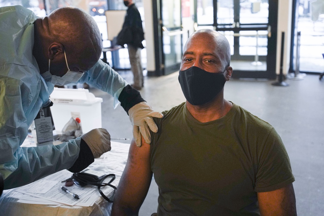 U.S. Marine Corps Maj. Gen. Michael E. Langley, the commander of U.S. Marine Corps Forces Europe and Africa, receives the mRNA-1273 COVID-19 vaccine at U.S. Army Garrison Patch Barracks, near Stuttgart, Germany, Jan. 26, 2021. The voluntary vaccines are being administered in a phased approach, prioritizing health care workers and first responders, as well as mission critical and deploying personnel. Marines will continue to practice safety protocols to diminish the risk of COVID-19. (U.S. Marine Corps photo by Cpl. Claudia Nix)