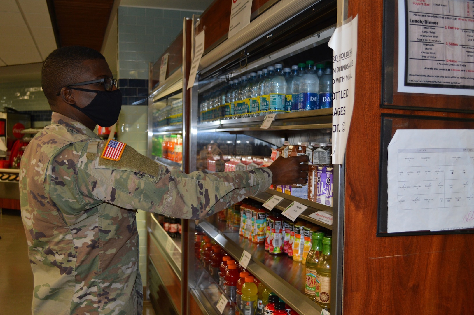 ec. Jean-Rene Louis, a nutrition case specialist in the Department of Nutrition chooses a beverage to go with his meal in the Brooke Army Medical Center dining facility, Dec. 8, 2020. Staff at BAMC’s Nutrition Department encourage everyone to focus on eating healthy during the holiday season and throughout the year. (U.S. Army photo by Daniel Calderón)