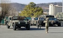 Soldiers with the 563rd Medical Logistics Company conduct proper guiding techniques for backing up a Humvee during the unit's driver's training, held Jan. 11-15 at Camp Carroll, South Korea.